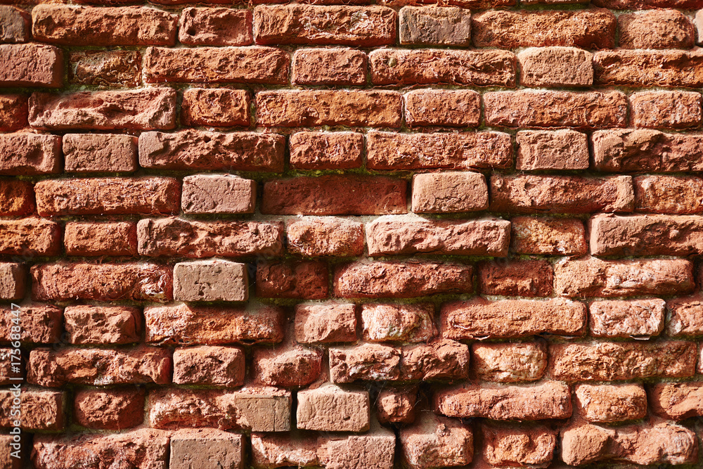 Half destroyed red brick wall of shabby construction or house Half destroyed red brick wall of shabby construction or house