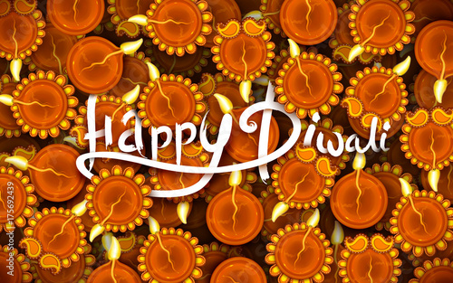 Burning diya on Happy Diwali Holiday background for light festival of India