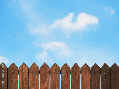 wooden fence against blue sky