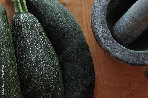 Courgette. Preparing vegetable dishes in a mortar.