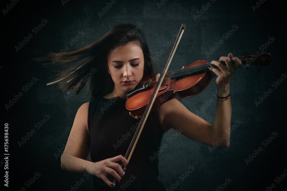 Beautiful musician playing violin