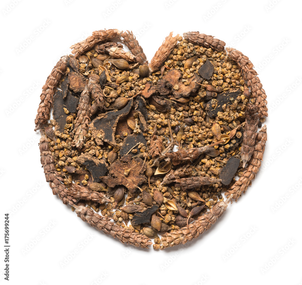 chinese herb medicine shaped like a heart on white background chinese herb medicine shaped like a heart on white background