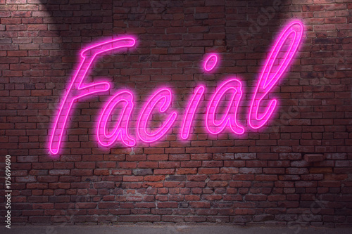 Tableau sur toile Leuchtreklame Facial an Ziegelsteinmauer