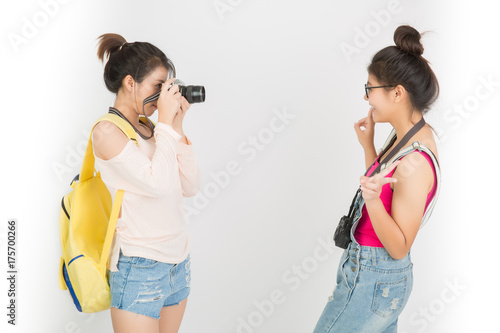 Half-length portrait of lovely asian models  looking at the photographer.