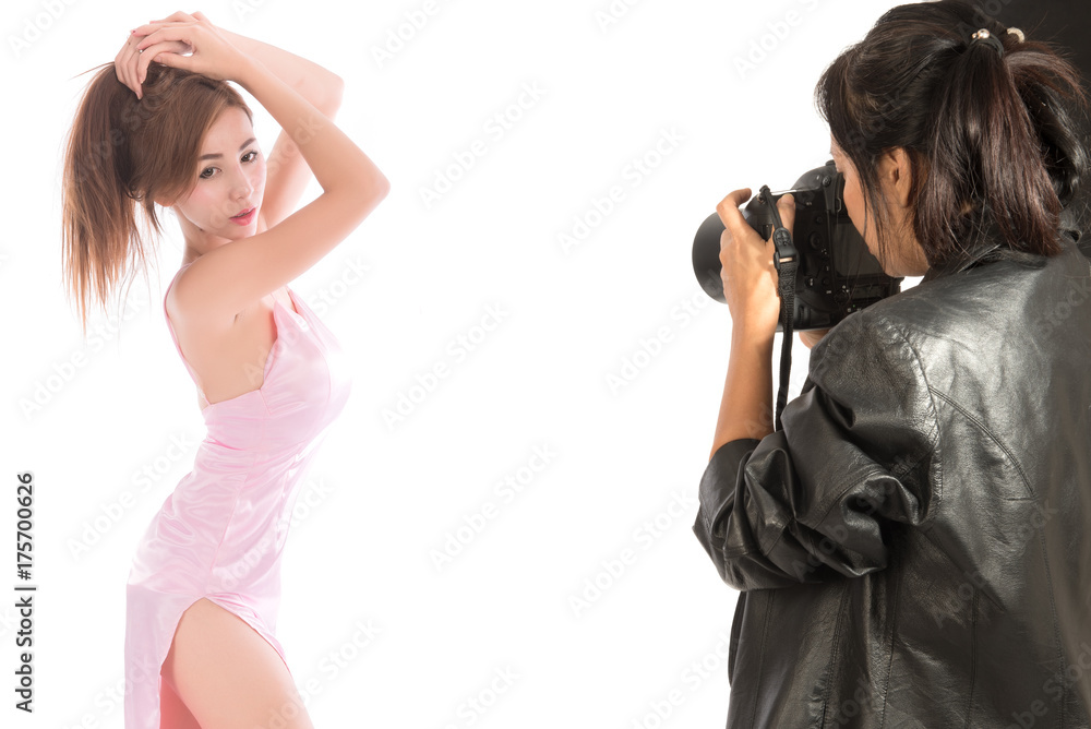 Photographer working with model in studio. Asian woman photography in action. Photographer working with model in studio. Asian woman photography in action.