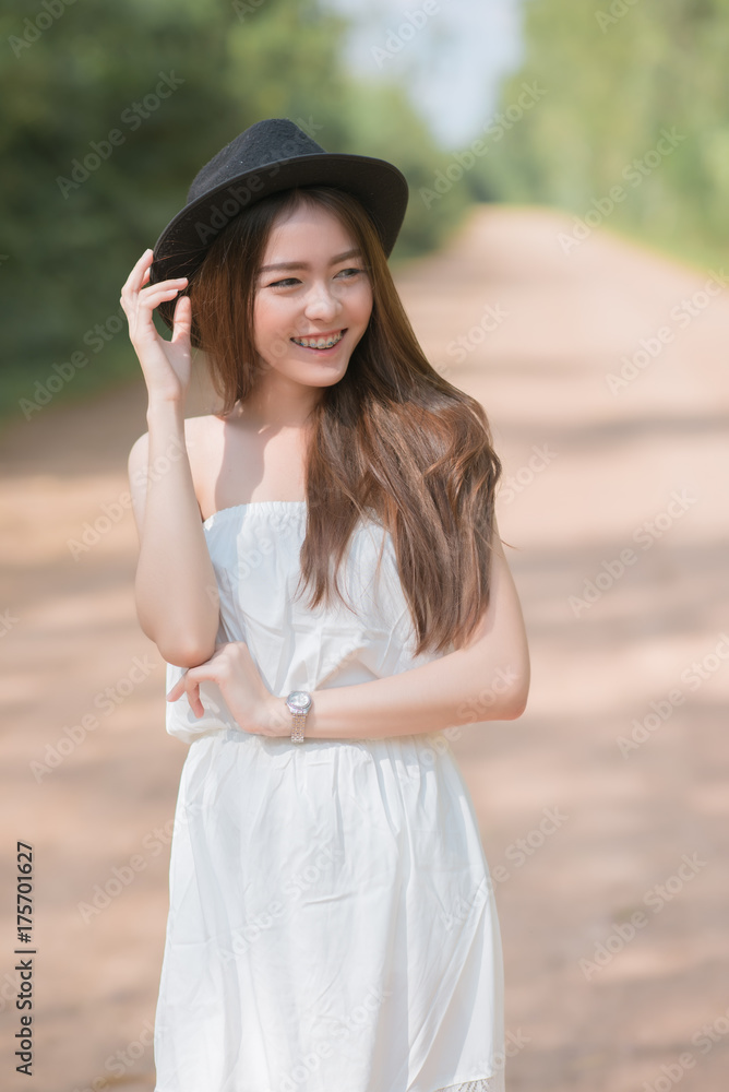 Portrait of a young beautiful  fashionable woman in a hat  posing. Asian woman wear hat.
