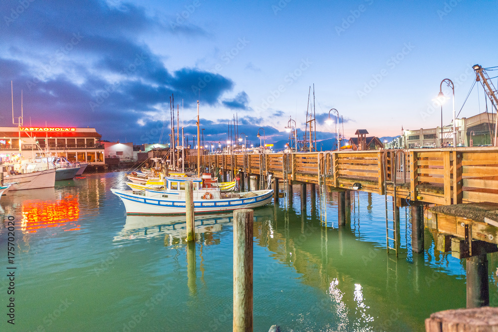 SAN FRANCISCO - AUGUST 6, 2017: Beautiful view of Fishermen Wharf port. The city attracts 20 million people annually - obrazy, fototapety, plakaty 