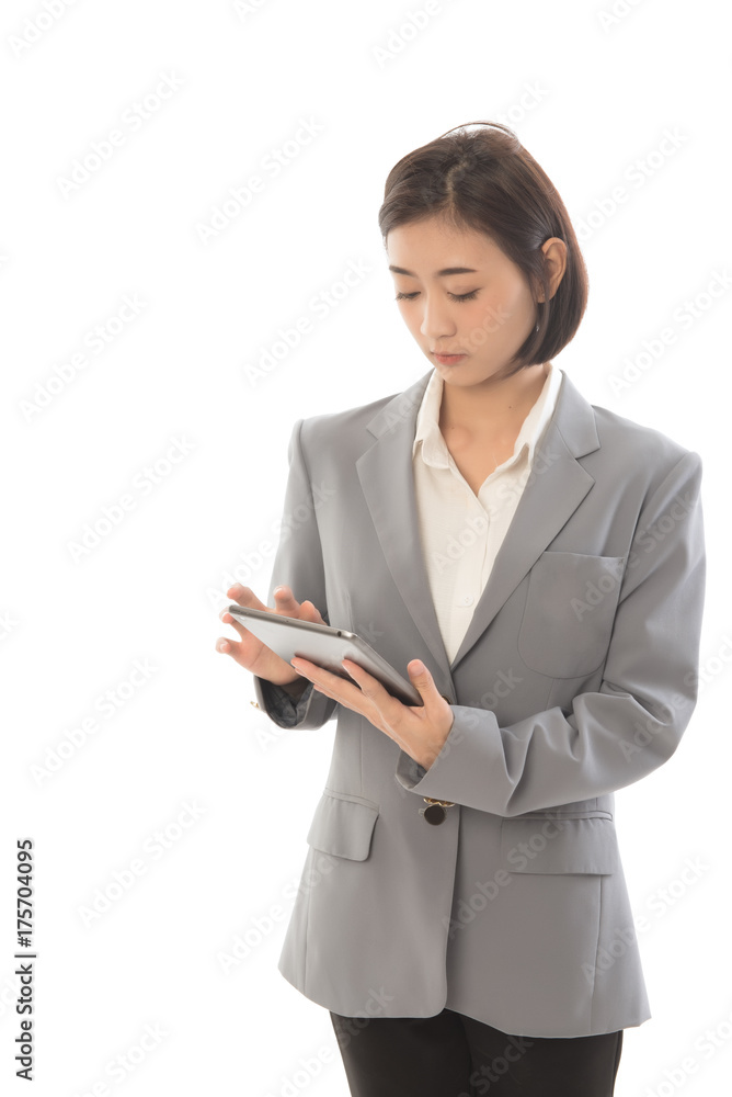 Portrait of asian businesswoman touching digital tablet and looking at it. This picture for working woman concept. Portrait of asian businesswoman touching digital tablet and looking at it. This picture for working woman concept.