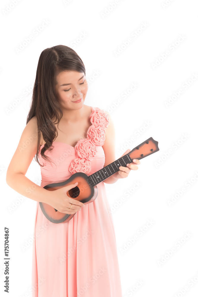 Young asian beauty woman holding ukulele on white background. Young asian beauty woman holding ukulele on white background.