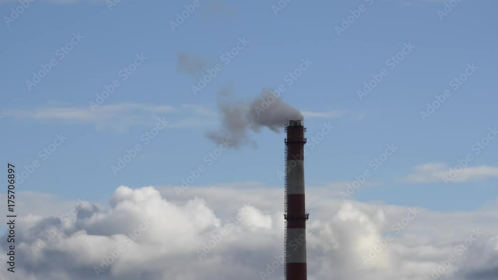 Moving clouds Power Plant pipe with smoke Latvia 4K