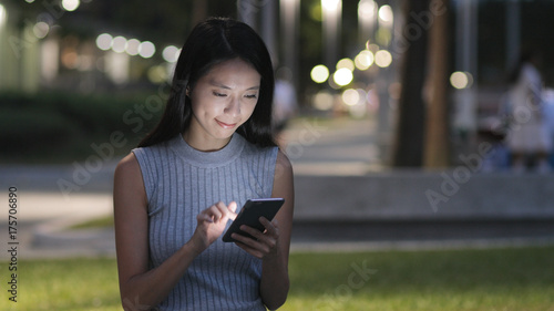 Photography Woman looking at mobile phone