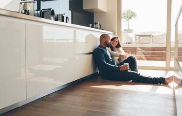 Loving young couple spending time together at home