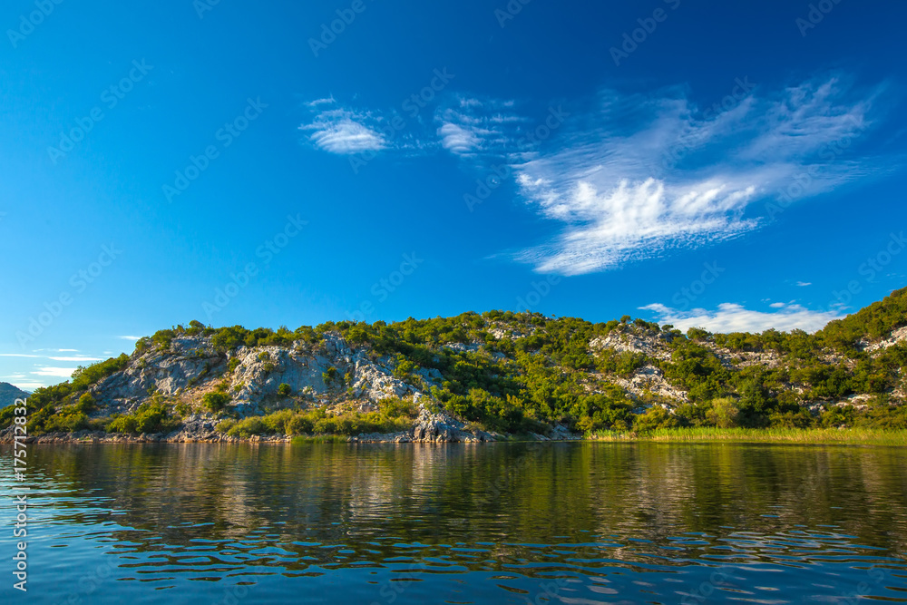Slope of a rocky mountain with trees on the Skadar Lake. Montenegro.