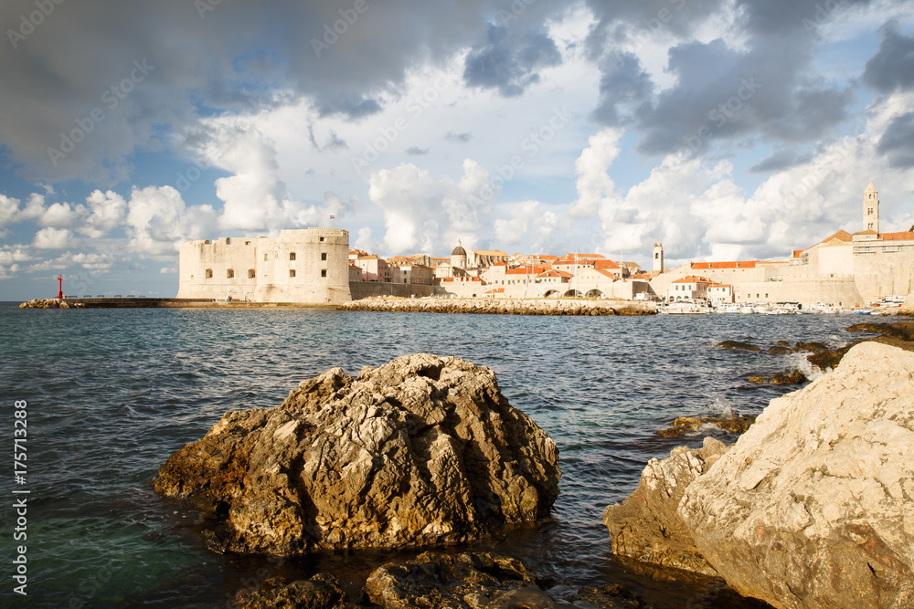 The stony coastline and the view of the old town and Fort St. John's. Dubrovnik. Croatia