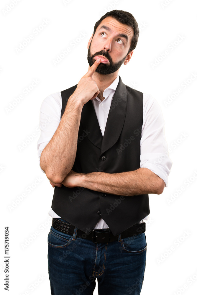 Fototapeta premium Cool man having doubts on isolated white background