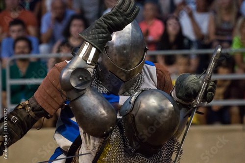 Two medieval warriors on a intense fight.