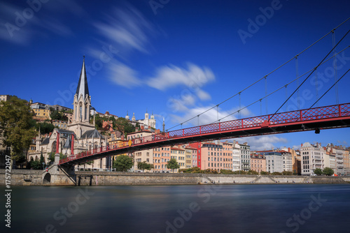 Passerelle (footbridge) Saint Georges over the Saone river and the Saint Georges church in Lyon, France.
