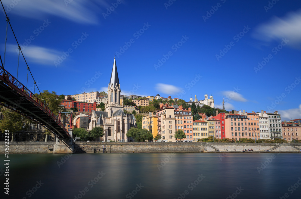 Passerelle (footbridge) Saint Georges over the Saone river  and the Saint Georges church in Lyon, France.
