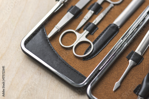 Manicure set on the wooden background 