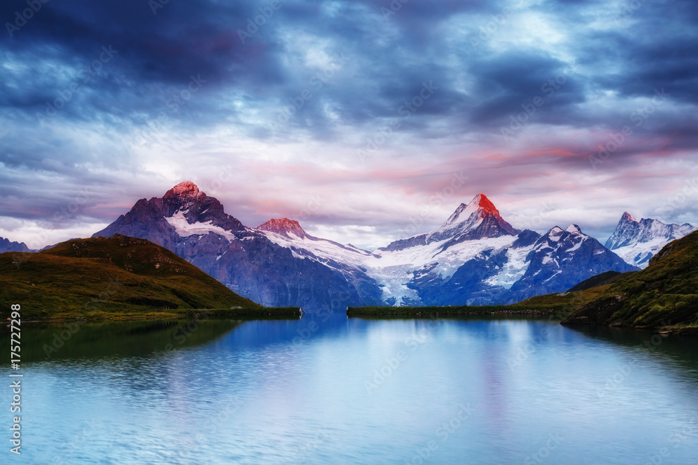 Great view of Mt. Schreckhorn and Wetterhorn above Bachalpsee lake. Location place Swiss alps, Grindelwald valley, Europe.