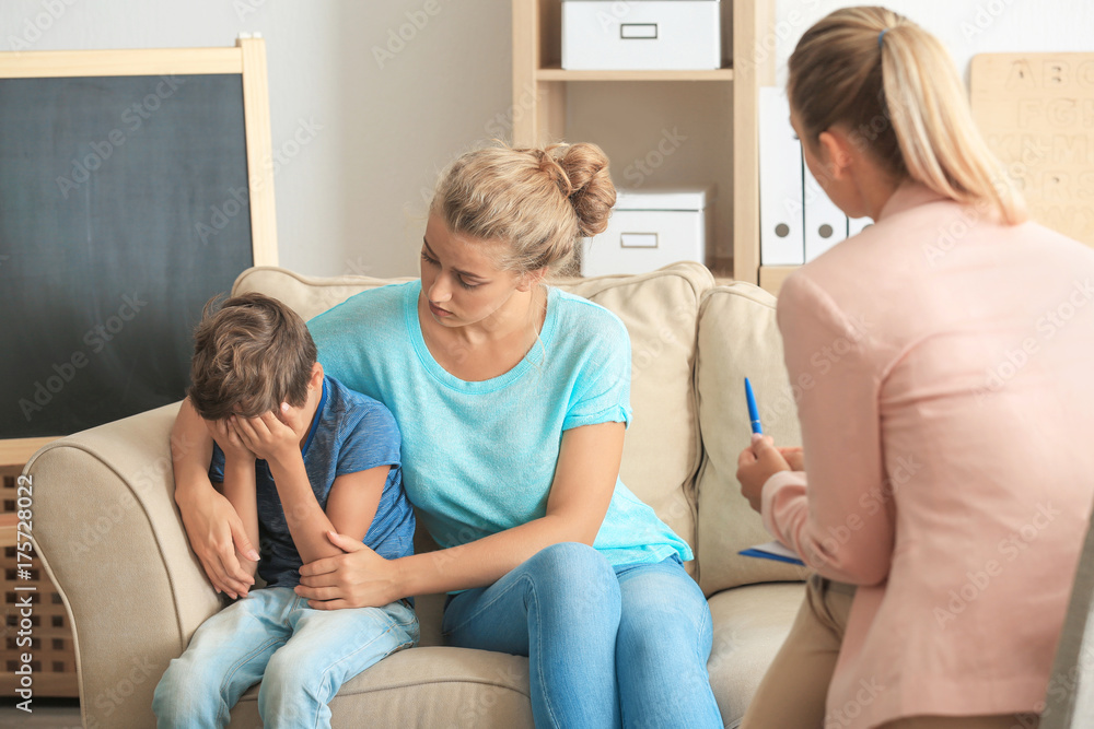 Young child psychologist working with family in office Young child psychologist working with family in office