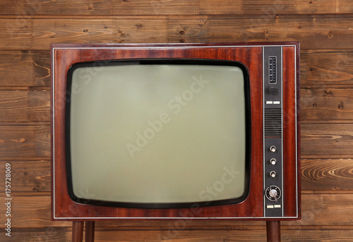 Retro TV on wooden background