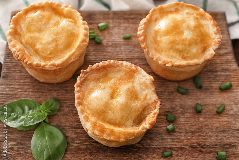 Delicious meat mini pies on board Delicious meat mini pies on board
