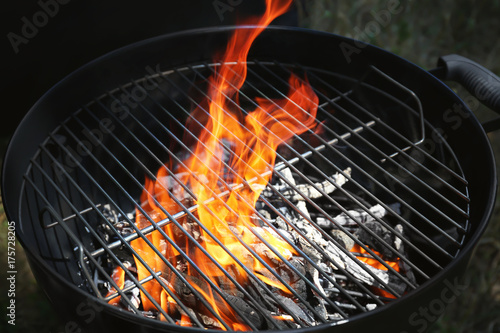 Empty grill with flame