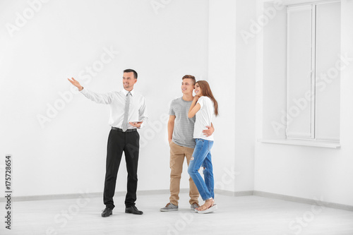 Estate agent showing apartm...