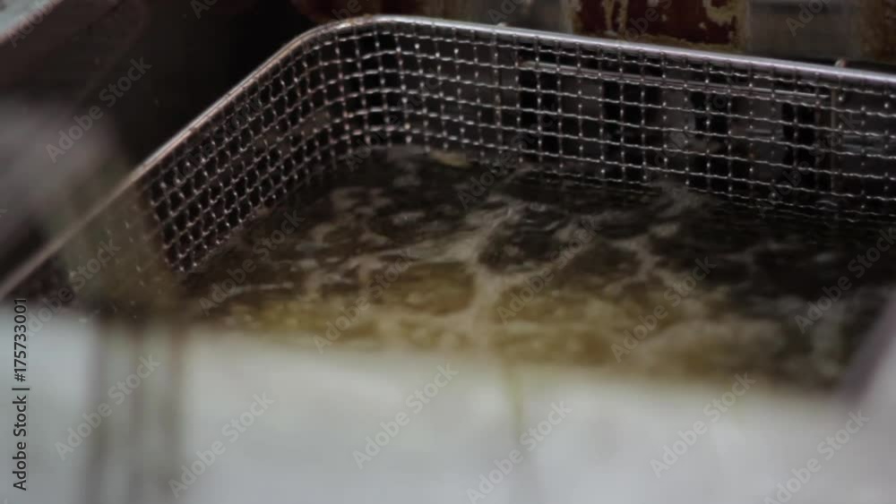 French fries in boiling oil French fries in boiling oil