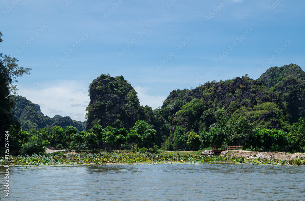 Rowboats transporting tourists in Inland Haolong Bay, Ninh Binh, Vietnam.