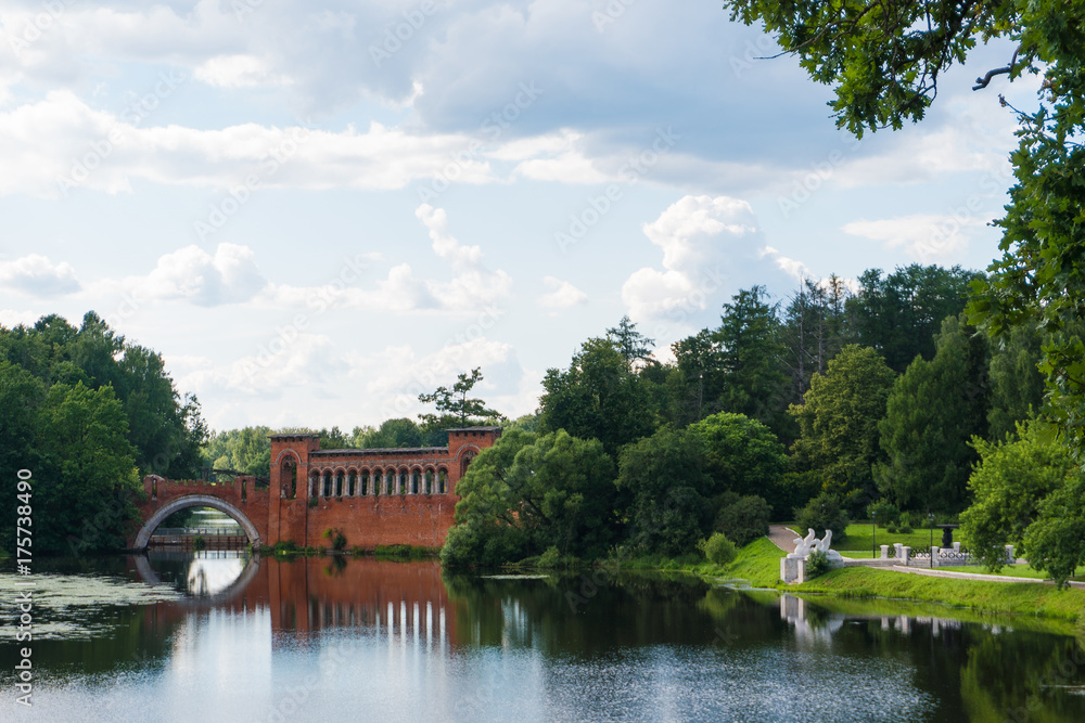 View of the pond and the old bridge in the Manor of Marfino, Russia.