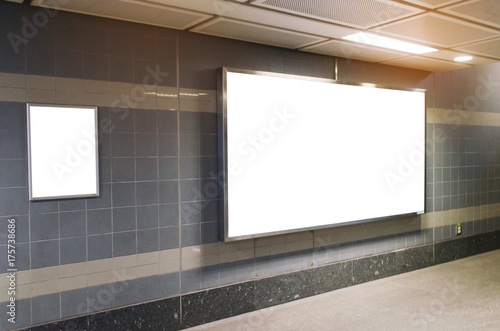 blank advertising billboard with copy space for your text message or media and content in subway train station or airport, information board, mock up banner, marketing and advertising concept