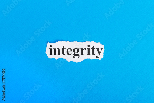 Integrity text on paper. Word Integrity on torn paper. Concept Image