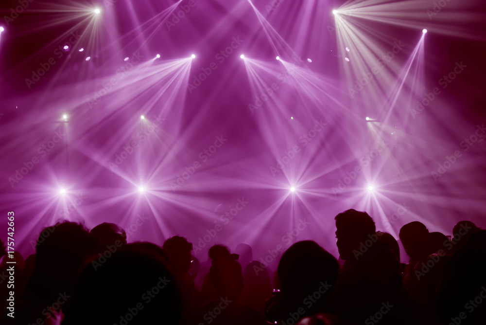 Light Show and Silhouette audience crowd people  club party with concert. Celebrate new year party , Blurry night club party people enjoy .Rock co  .Abstract blur for background