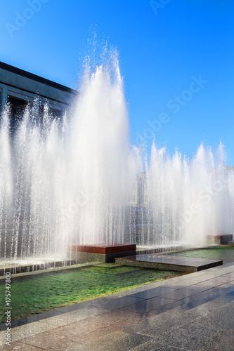 spouting fountains in a beautiful Sunny day in a modern European city