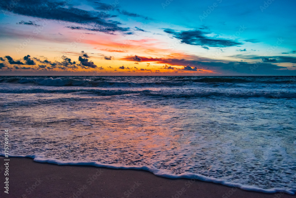 colorful morning at the beach just before sunrise