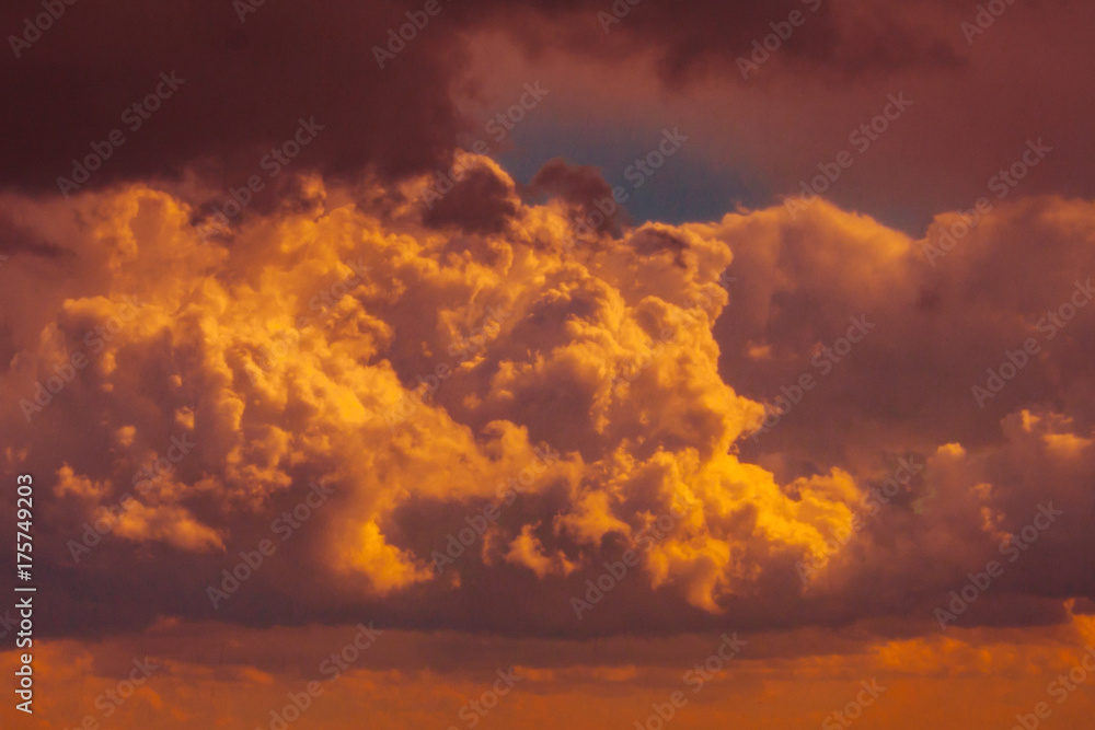 Close up view of dramatic red sunset clouds (toned)