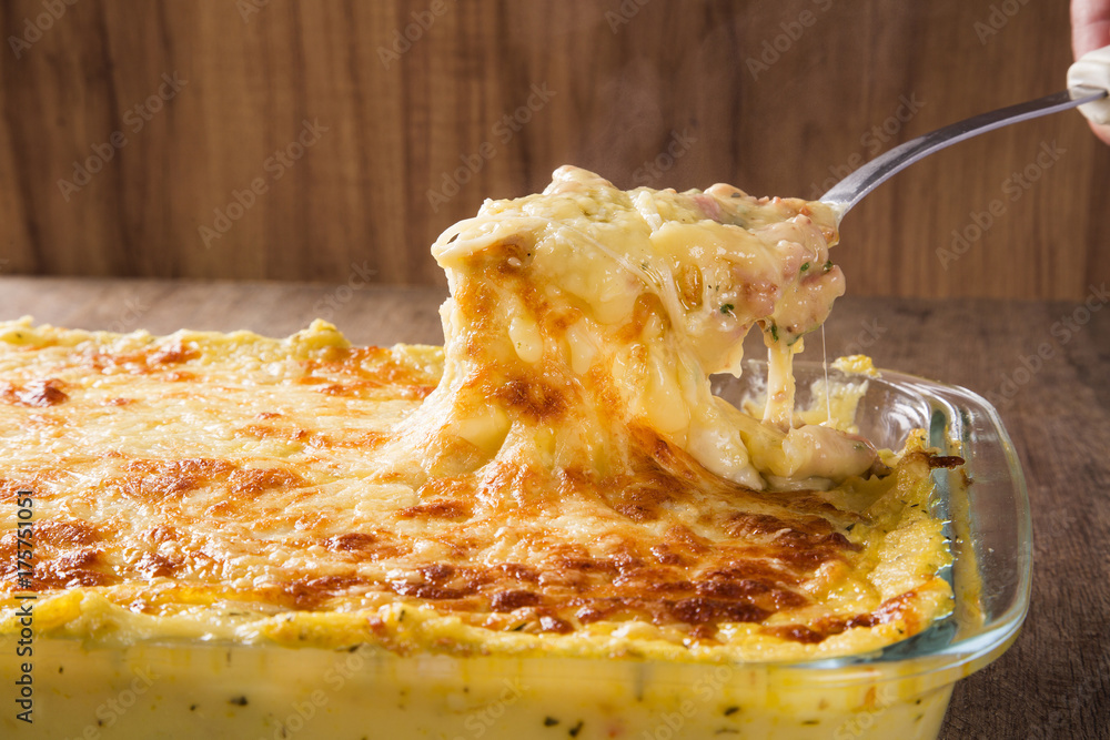 Ταπετσαρία Hearty potato gratin with ham and parmesan cheese, cream and delicious cured bac