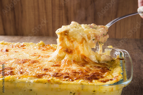 Принти на полотні Hearty potato gratin with ham and parmesan cheese, cream and delicious cured bac