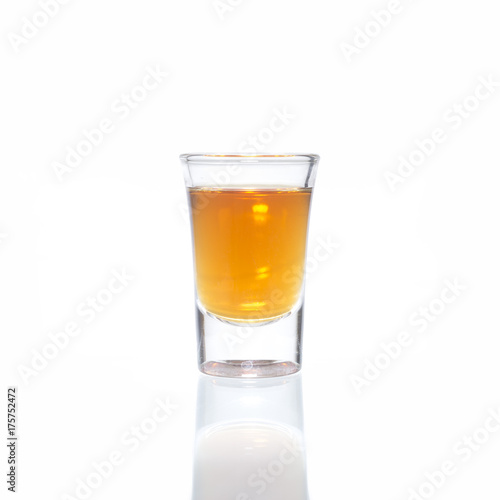 Cocktail Glass with brandy or whiskey - Small Shot. Isolated on white background