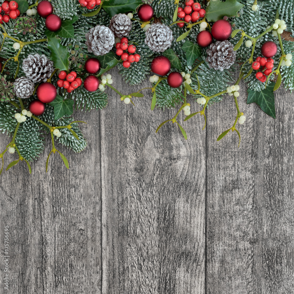 Christmas background border with holly, ivy and mistletoe on old