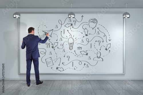 Businessman drawing a project sketch on a board 3D rendering