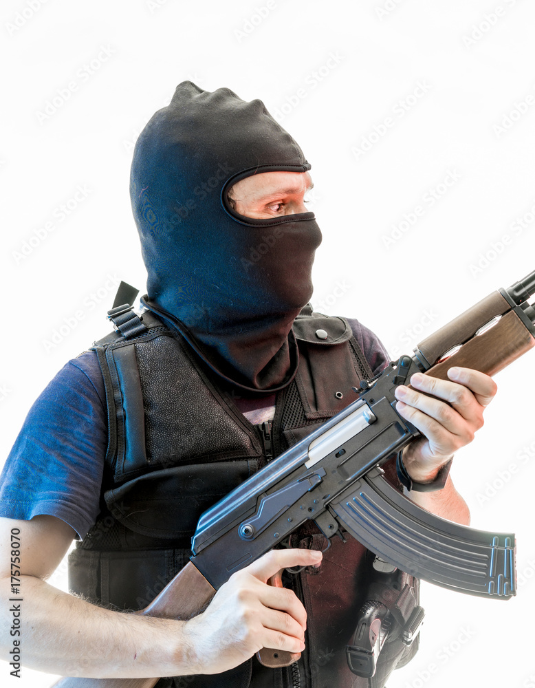man armed with balaclava and bulletproof vest, gun and shotgun, kalashnikov man armed with balaclava and bulletproof vest, gun and shotgun, kalashnikov