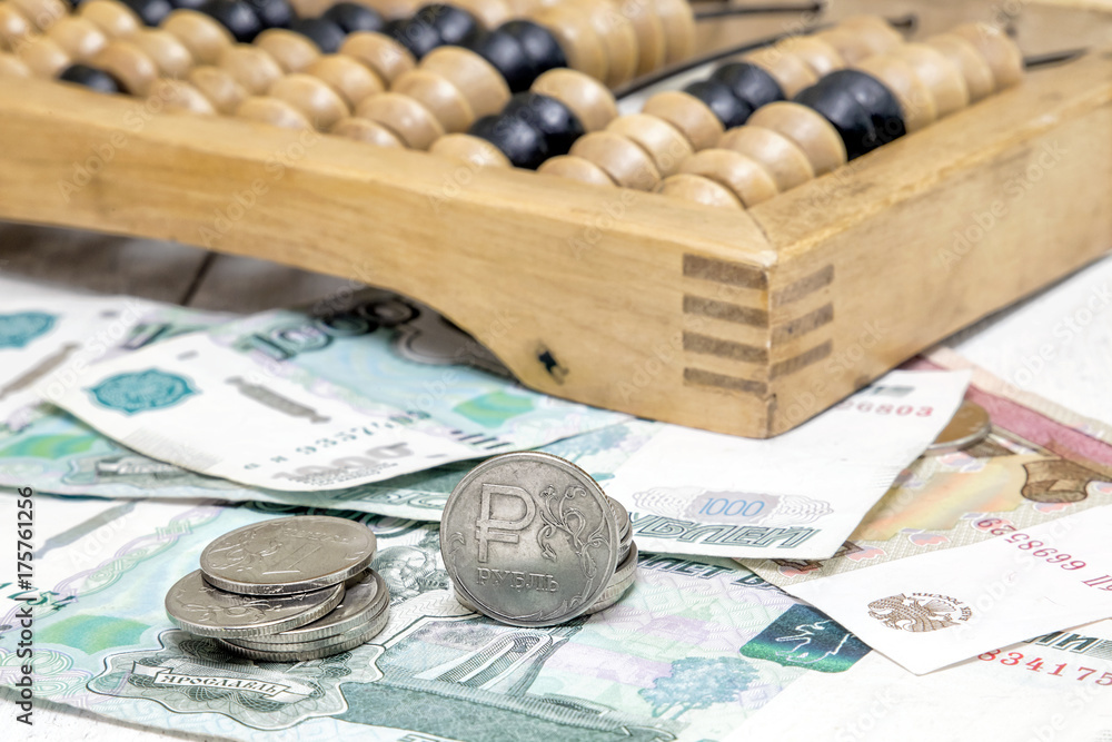 Iron ruble, paper bills and old abacus. Business still life Iron ruble, paper bills and old abacus. Business still life