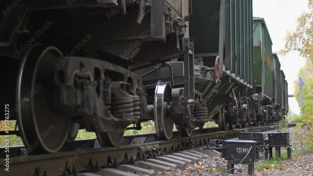 Long train running fast in slow motion on railway on beautiful autumn forest. 3840x2160 Long train running fast in slow motion on railway on beautiful autumn forest. 3840x2160