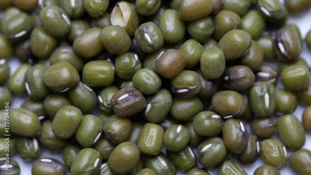 Dried grains or seeds of lentil rotating on white background. Close up Dried grains or seeds of lentil rotating on white background. Close up