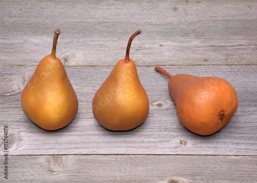 green pears on a wooden table © Adi Ciurea
