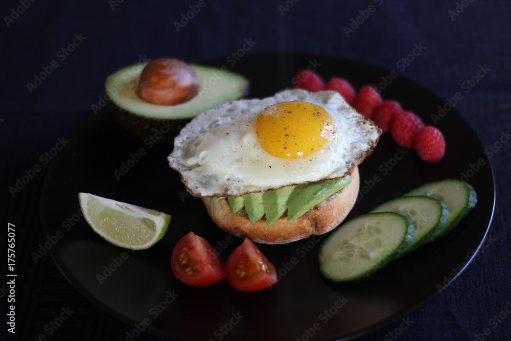 Avocado toast with tomatoes, cucumber, lime and raspberries Avocado toast with tomatoes, cucumber, lime and raspberries