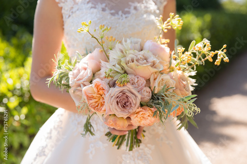 beautiful wedding bouquet in bride's hands.